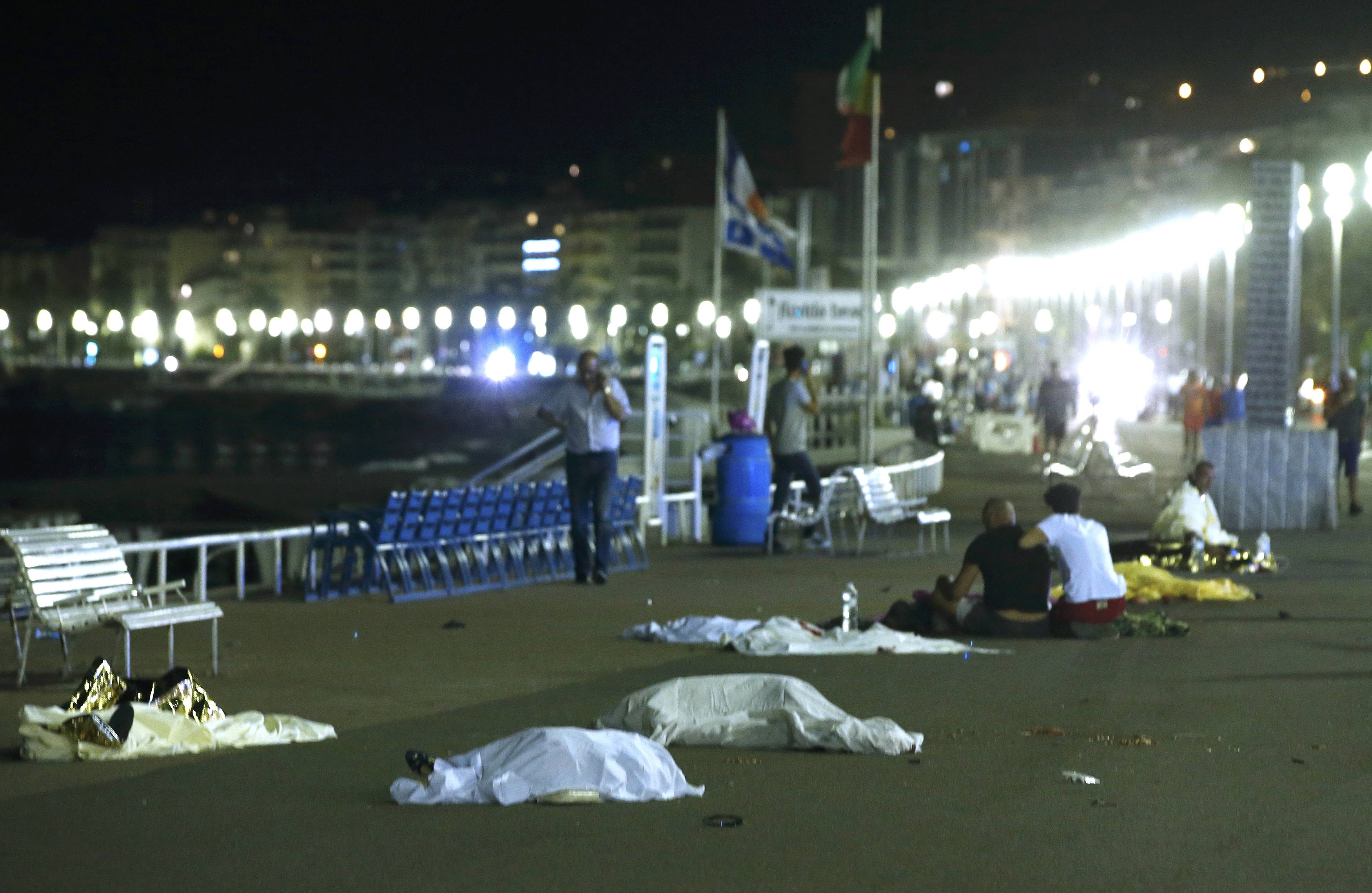 ATTENTION EDITORS - VISUAL COVERAGE OF SCENES OF INJURY OR DEATH - Bodies are seen on the ground July 15, 2016 after at least 30 people were killed in Nice, France, when a truck ran into a crowd celebrating the Bastille Day national holiday, July 14, 2016. REUTERS/Eric Gaillard TEMPLATE OUT. NYTCREDIT: Eric Gaillard/Reuters